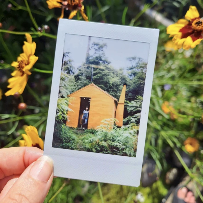 Sarah at a hut